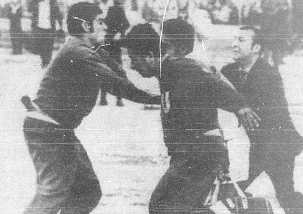 Nicolás Fuentes, who had been sent off, tries to reach the Venezuelan referee, but is restrained by members of the national coaching staff at the end of the match.  (Photo: GEC Historical Archive)