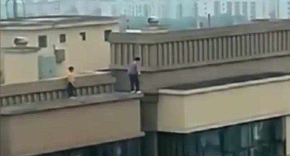 Two children are recorded jumping between two 27-story buildings in China