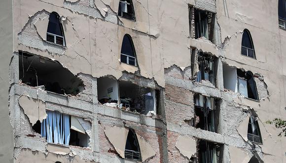 Remains of a damaged building stands after an earthquake in Mexico City, Tuesday, Sept. 19, 2017. A powerful earthquake has jolted Mexico, causing buildings to sway sickeningly in the capital on the anniversary of a 1985 quake that did major damage. (AP Photo/Rebecca Blackwell)