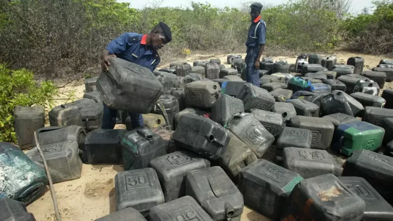 Nigerian security agents raid the hideouts of oil thieves, but have been accused of stealing the oil.  (AFP).