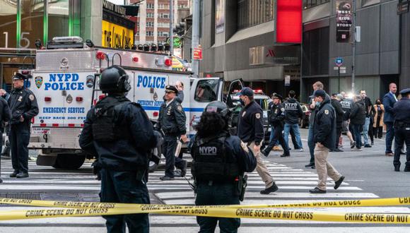 New York City police officers stand guard after a shooting incident in Times Square, New York, U.S., May 8, 2021. REUTERS/Jeenah Moon