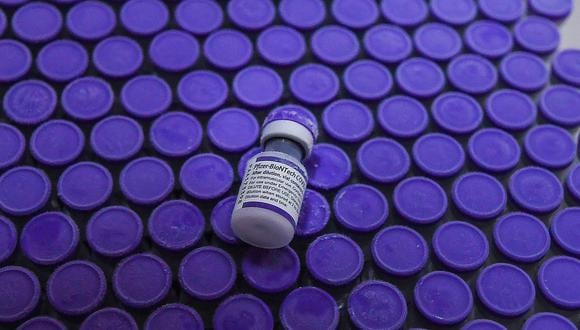 Vials of the Pfizer/BioNTech Covid-19 coronavirus vaccine are seen before being taken to a cold-storage freezer at the National Institute Of Hygiene And Epidemiology in Hanoi on October 12, 2021. (Photo by Nhac NGUYEN / AFP)