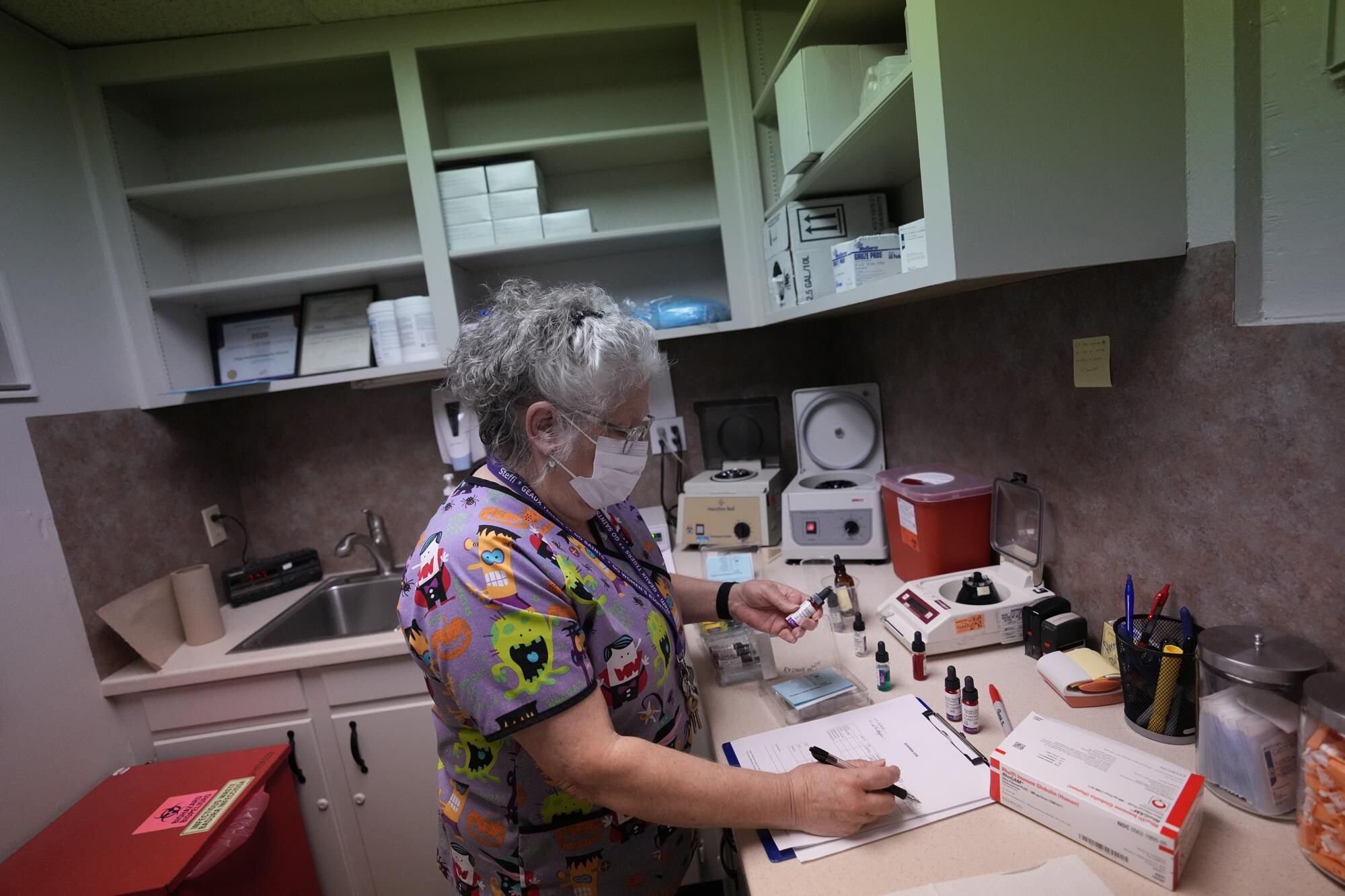 Laboratory technician Stephannie Chaffee prepares materials to be used to test women's blood prior to patient arrival, Saturday, Oct. 9, 2021, at Hope Medical Group for Women in Shreveport, La. (AP Photo / Rebecca Blackwell ).