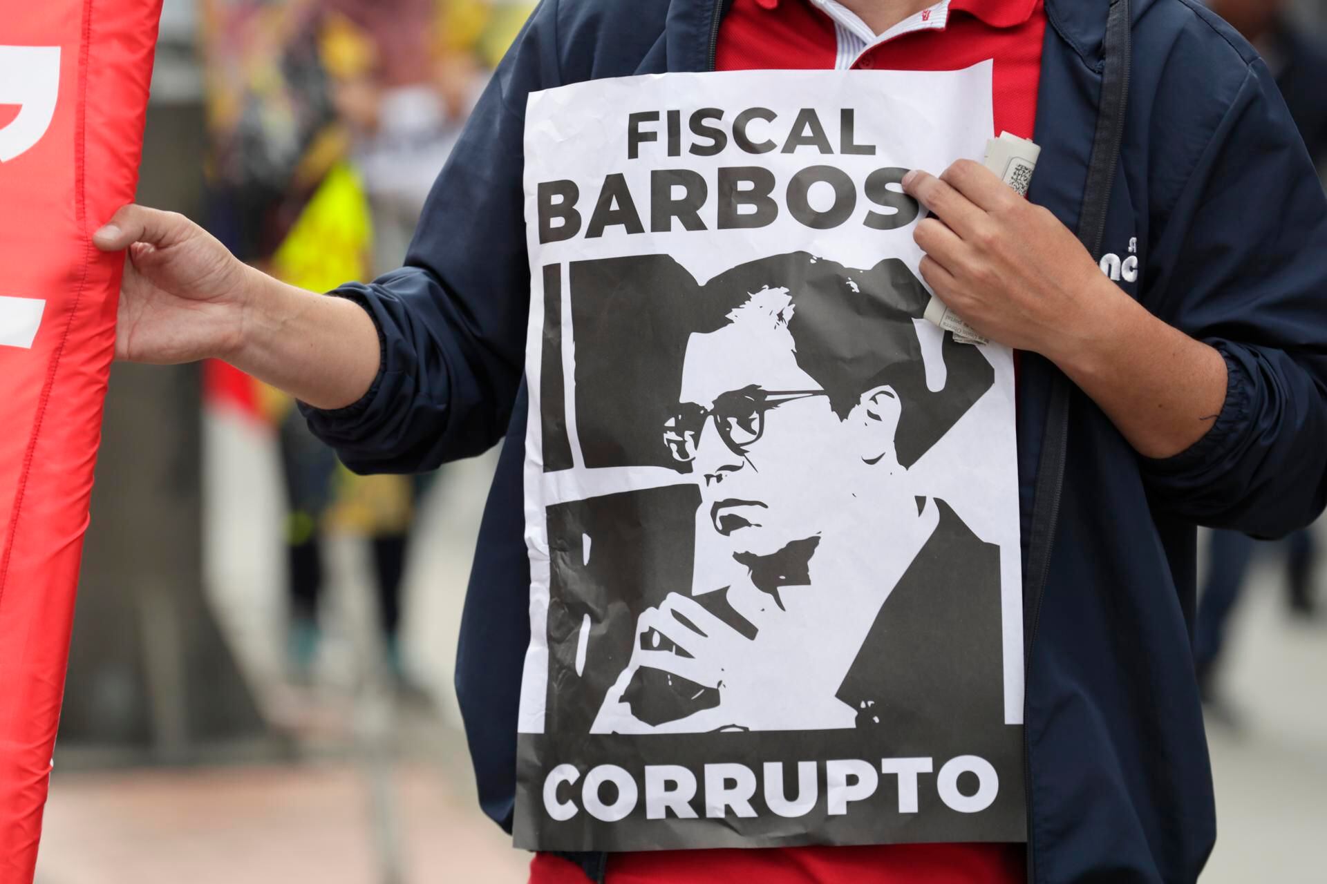 A citizen today shows a poster against the Colombian Attorney General, Francisco Barbosa, during a demonstration in support of the social reforms of the Government of Gustavo Petro, in the streets of Bogotá (Colombia).  EFE/Carlos Ortega