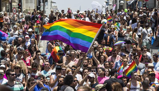 Israelis and tourists march during the Gay Pride Parade in Tel Aviv Israel Friday, June 9, 2017. About 200,000 people from the LGBT community in Israel and abroad attended in Tel Aviv's annual gay pride parade. (AP Photo/Sebastian Scheiner)