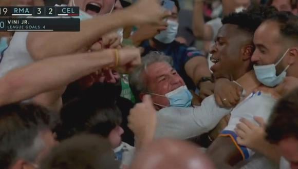 Vinicius se olvidó del COVID-19 y saltó a las gradas del Bernabéu tras convertir frente al Celta | VIDEO