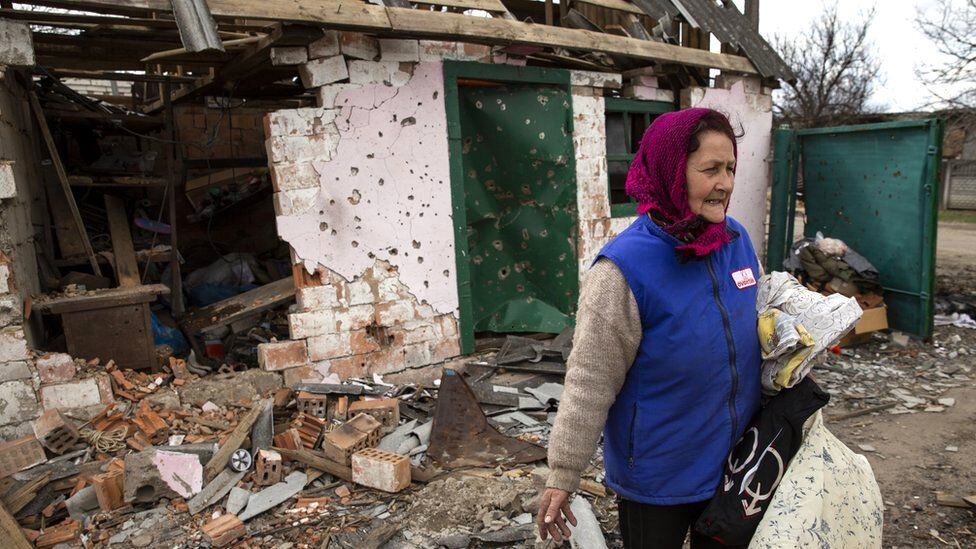 A woman among the rubble of her house near kyiv.  (GETTY IMAGES).