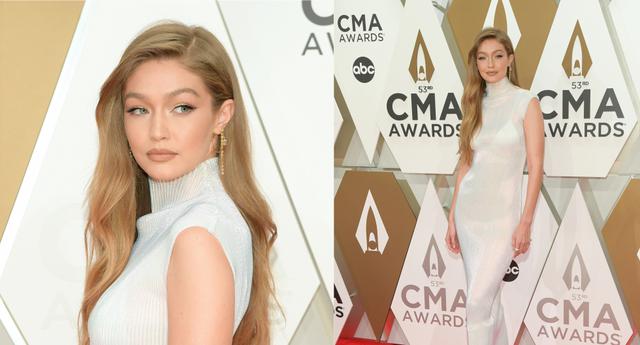 La noche de ayer Gigi Hadid estuvo en los 'CMA Awards' en Nashville, Tennessee. A su paso por el evento uso un vestido de corte entubado en color perla. Mira más detalles de su look en la galería. (Foto: AFP)