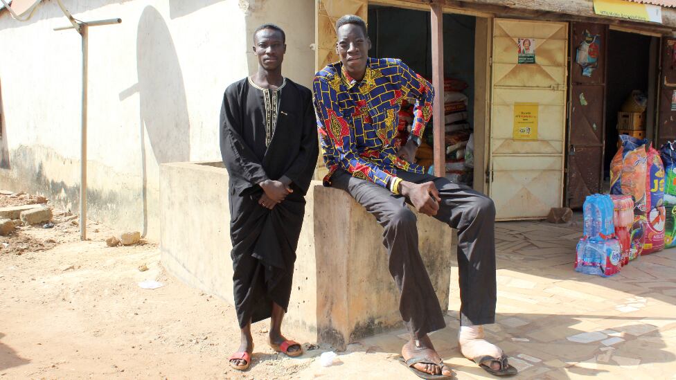 Awuche now lives with his older brother (left) in Gambaga.
