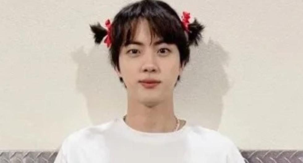 BTS |  Jin disguises himself as the doll from ‘The Squid Game’ and his companions troll him with: ‘Green light, red light’