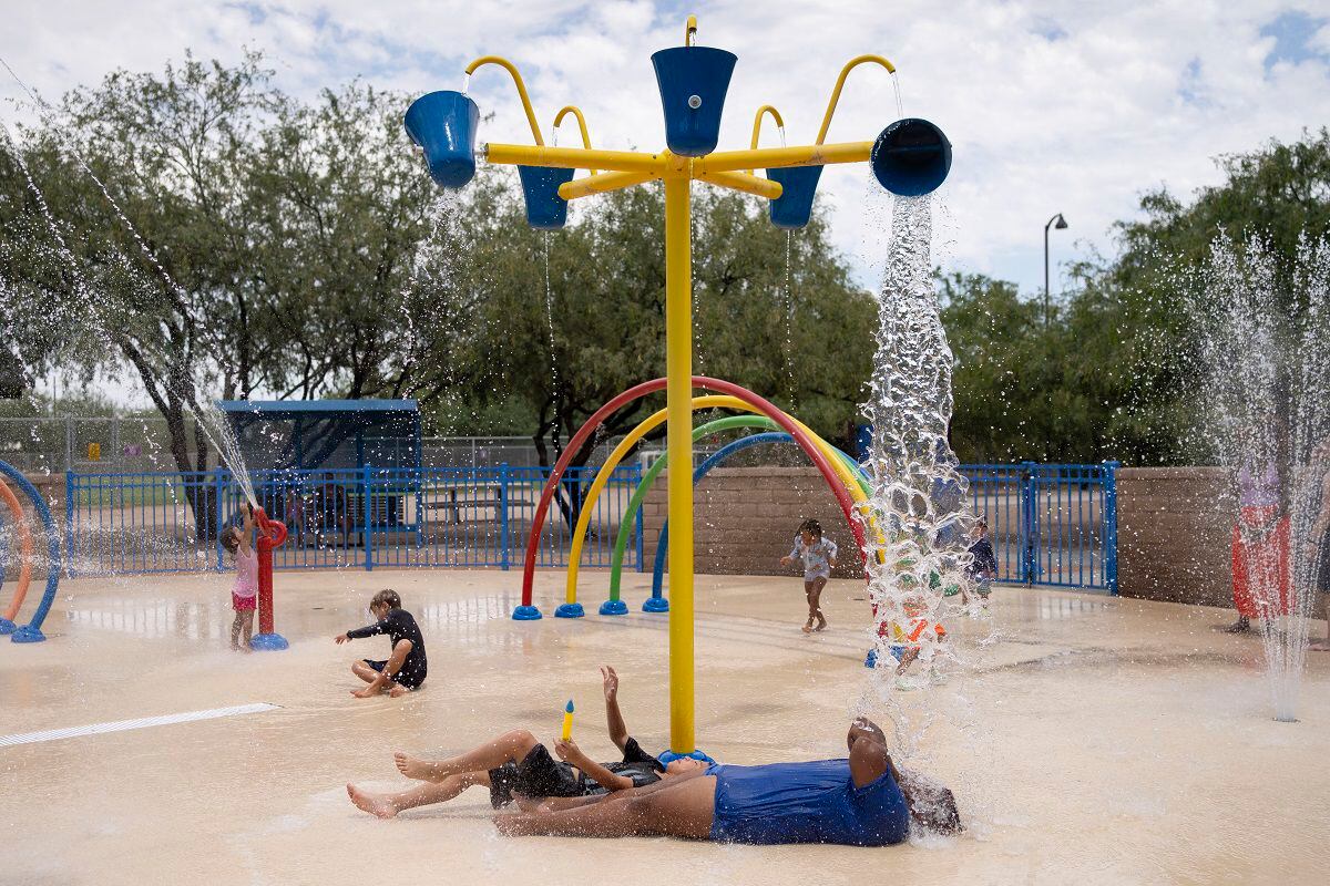 Residents have fun at Brandi Fenton Memorial Park water park during a heat wave in Tucson, Ariz., on July 15, 2023. (Photo by Rebecca NOBLE/AFP)