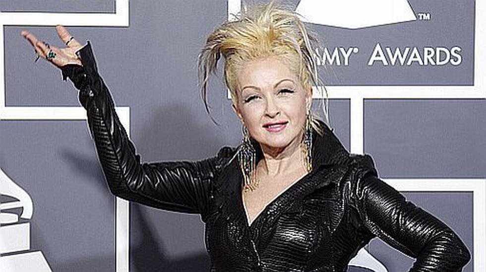 Cyndi Lauper poses on arrival at the 53rd annual Grammy Awards in Los Angeles