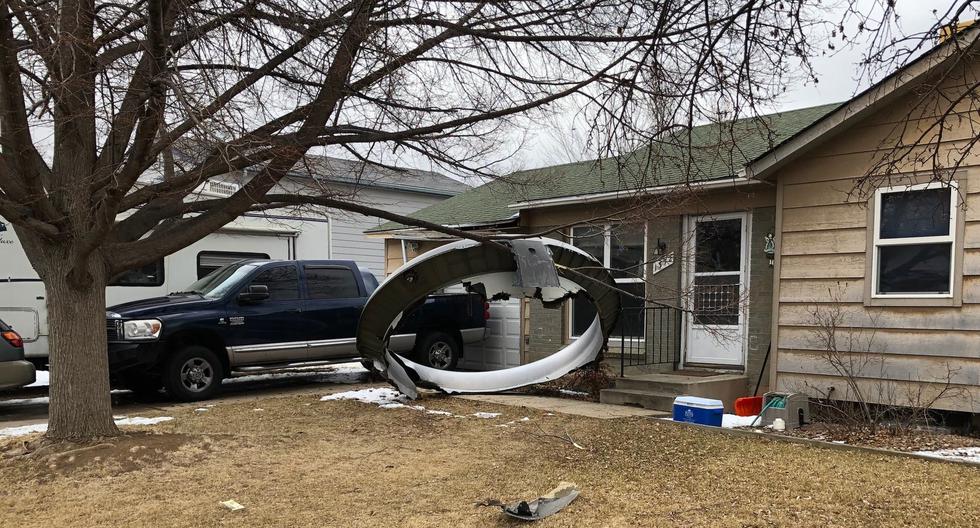 Parts of a United Airlines plane fall on homes in a Denver neighborhood