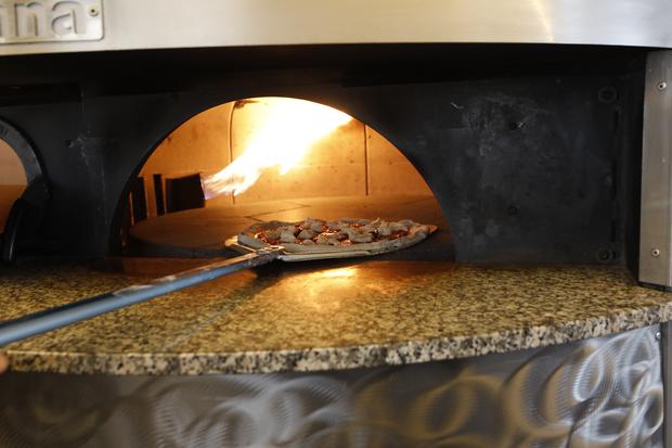Their huge oven allows them to cook pizzas in less than five minutes.