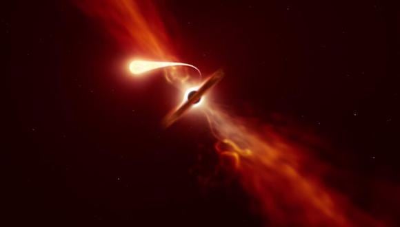 Esta ilustración representa a una estrella (en primer plano) experimentando espaguetificación al ser absorbida por un agujero negro supermasivo (al fondo) durante un "evento de disrupción de marea". (ESO)