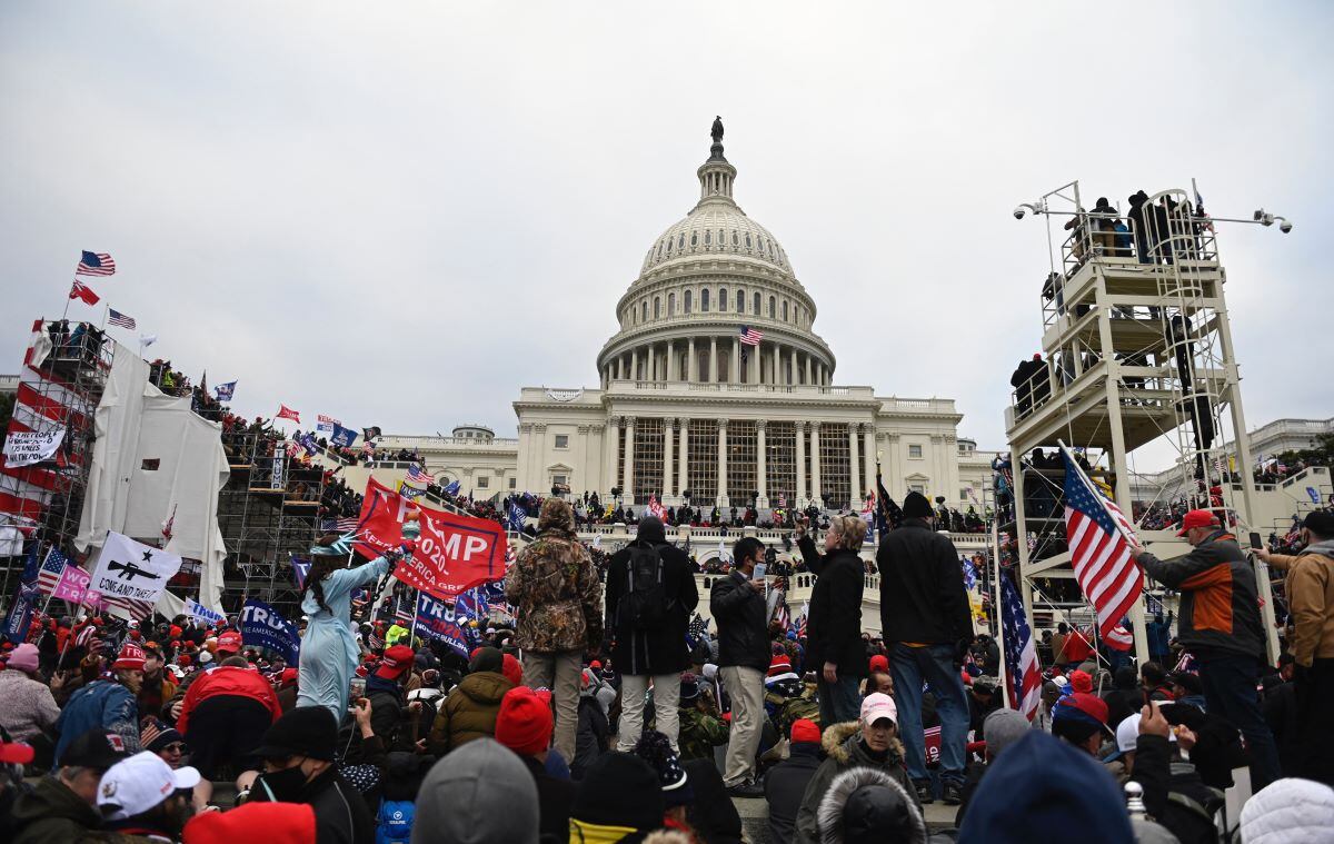 In this file photo taken on January 6, 2021, supporters of US President Donald Trump gather in front of the Capitol before storming it.  (ANDREW CABALLERO-REYNOLDS / AFP).