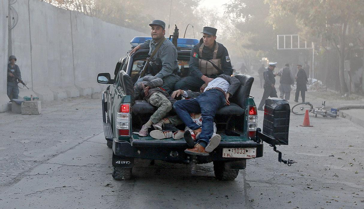 ATTENTION EDITORS - VISUAL COVERAGE OF SCENES OF INJURY OR DEATH  Injured men are carried away in a police vehicle after a blast in Kabul, Afghanistan. October 31, 2017. REUTERS/Omar Sobhani    TEMPLATE OUT