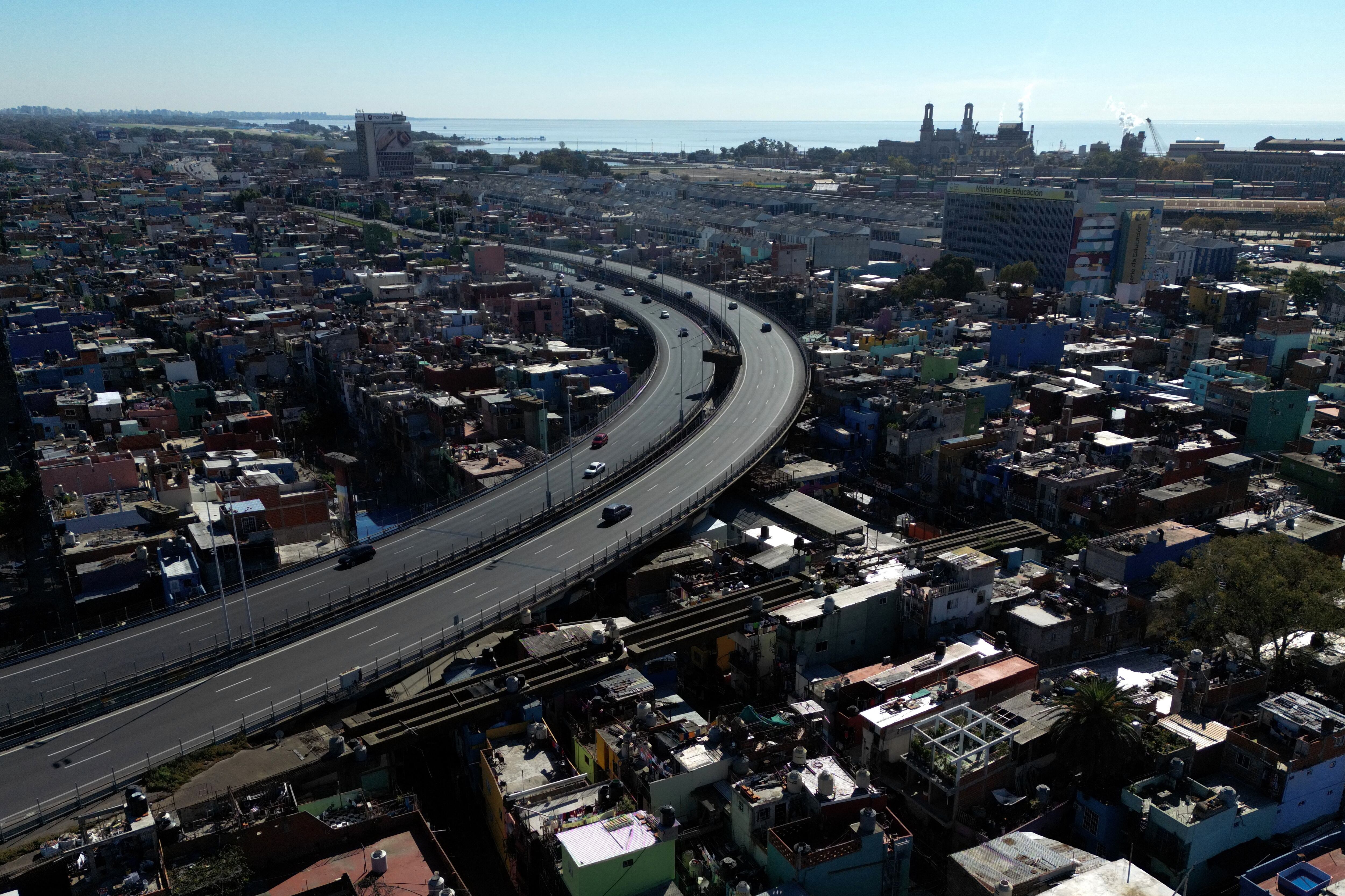 Aerial view of the Presidente Arturo Umberto Illia highway over the Padre Carlos Mujica neighborhood (known as Villa 31) in Buenos Aires, Argentina, taken on May 9, 2024, during a general strike called by the CGT.  (Photo by Luis ROBAYO/AFP).