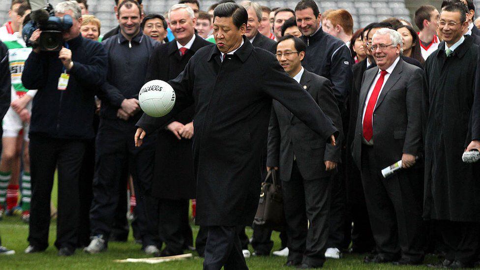 President Xi Jinping is known to be a football lover.  Here he is seen kicking the ball during a visit to Dublin in 2012. (GETTY IMAGES)