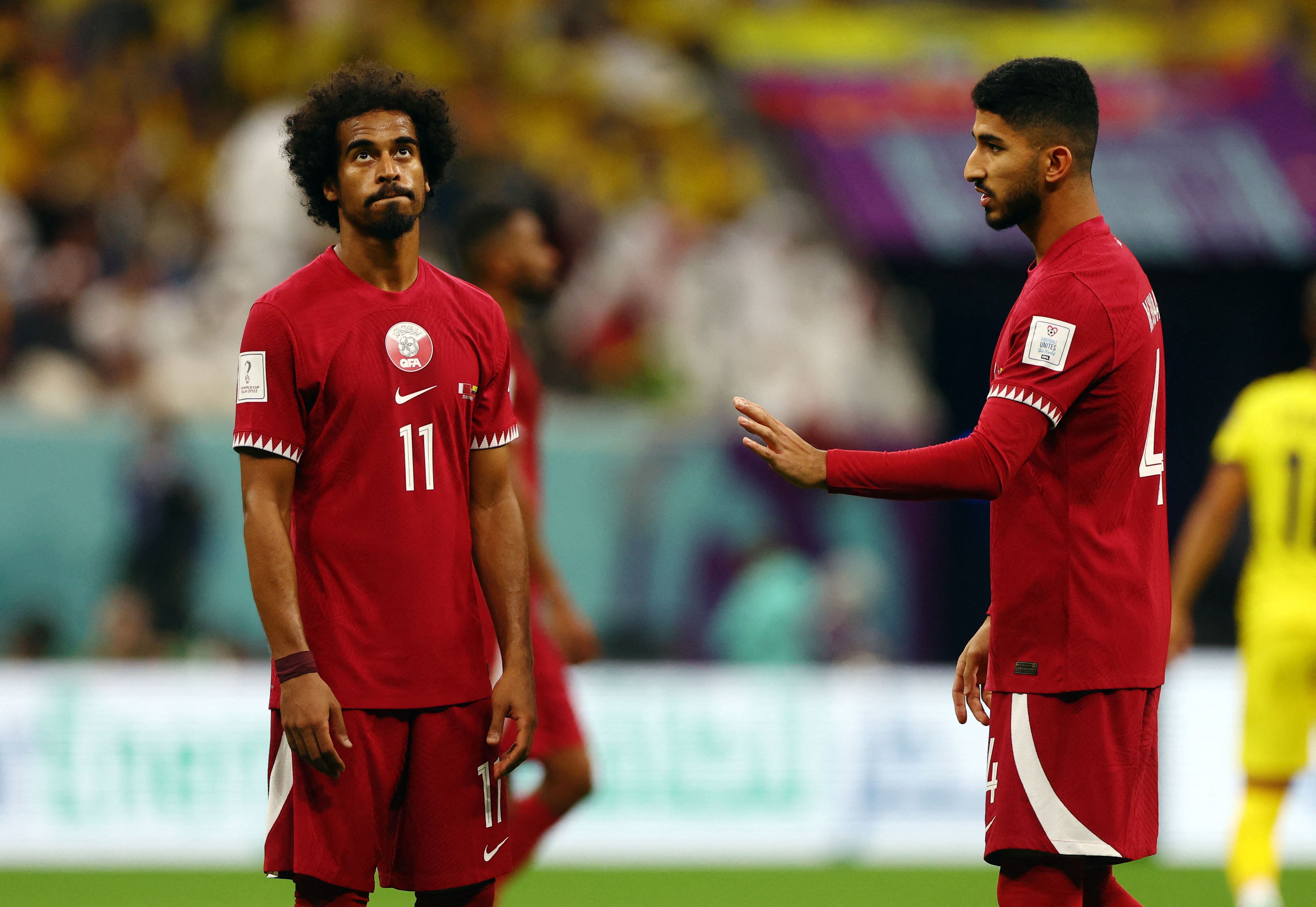 Soccer Football - FIFA World Cup Qatar 2022 - Group A - Qatar v Ecuador - Al Bayt Stadium, Al Khor, Qatar - November 20, 2022 Qatar's Akram Afif looks dejected REUTERS/Kai Pfaffenbach