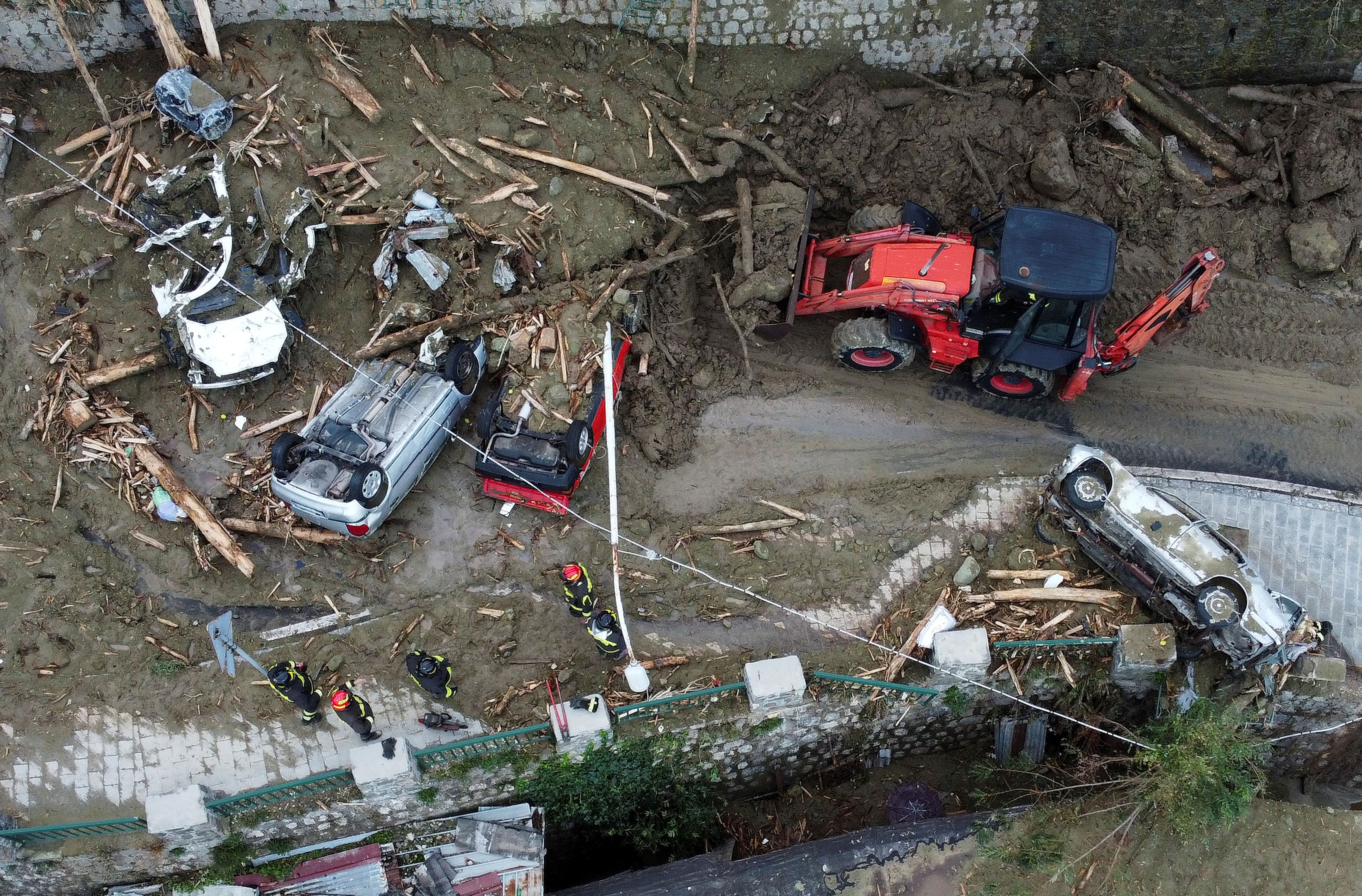 Rescuers work at the scene of a landslide on the Italian holiday island of Ischia, Italy.