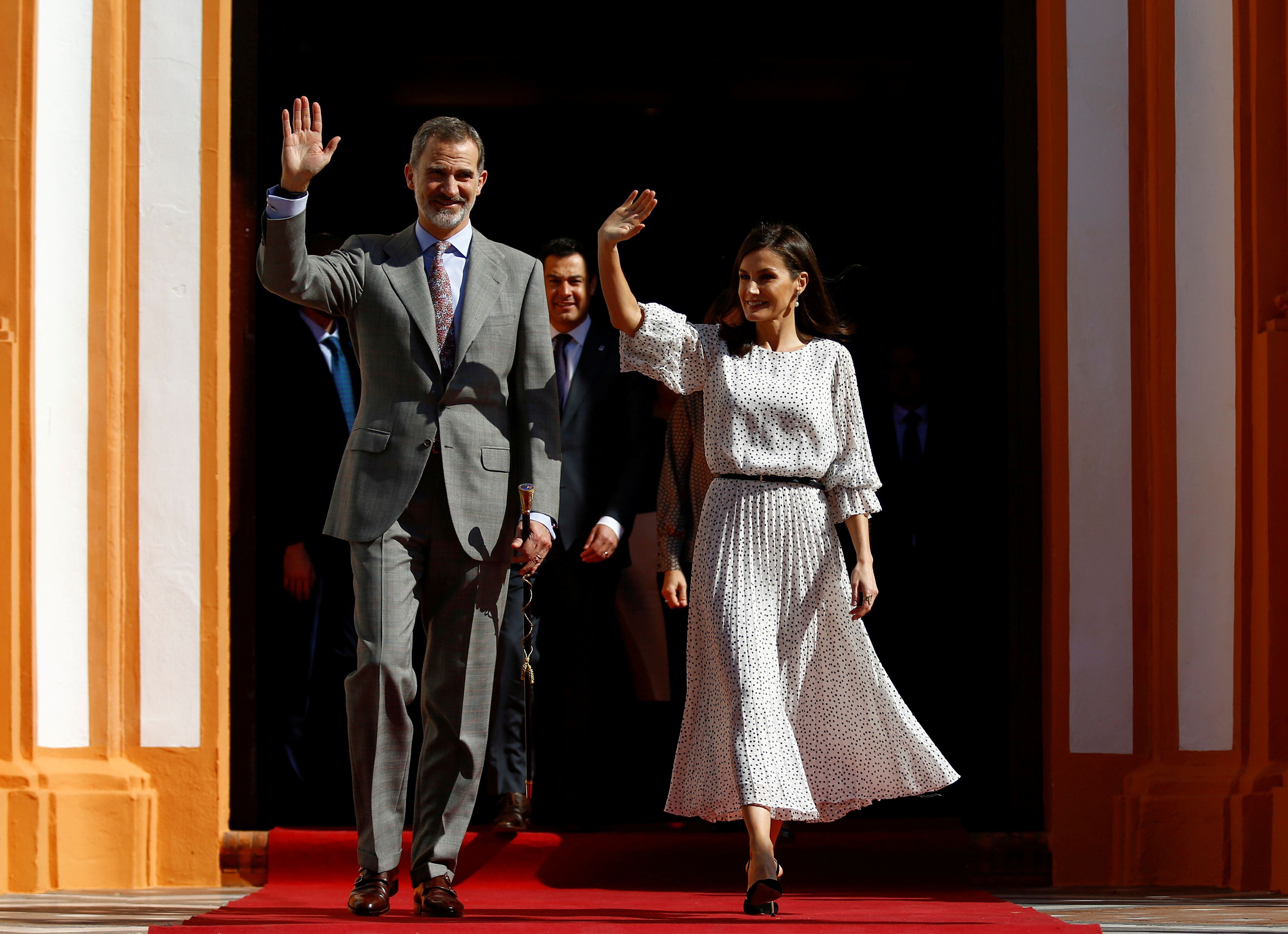 King Felipe VI and Queen Letizia of Spain wave during their visit to Almonte, southern Spain.  REUTERS/Marcelo del Pozo