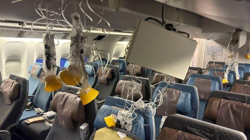 This is what it looked like inside the plane to Singapore, on which a passenger lost his life.  (GET IMAGES).