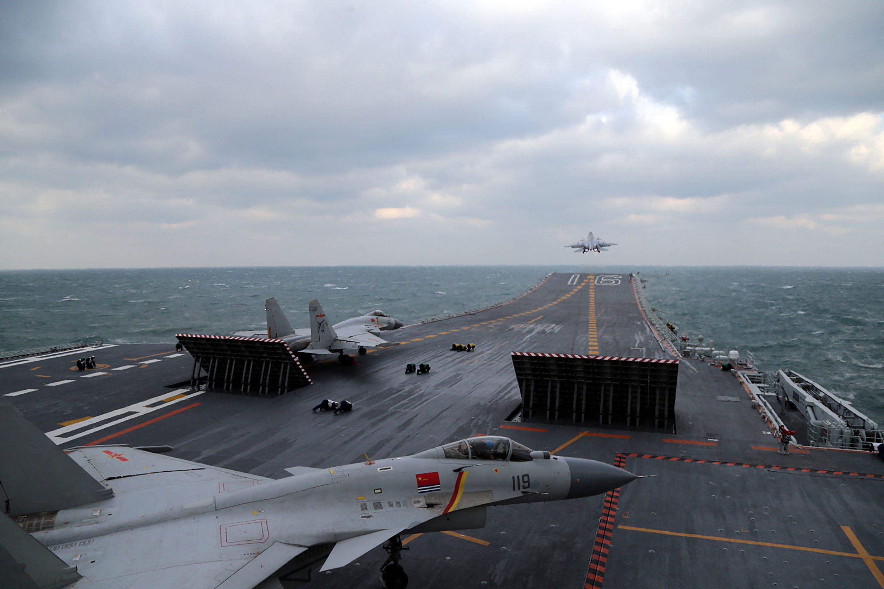This photo taken on December 23, 2016 shows Chinese J-15 fighter jets taking off from the aircraft carrier Liaoning.  (Photo: AFP).