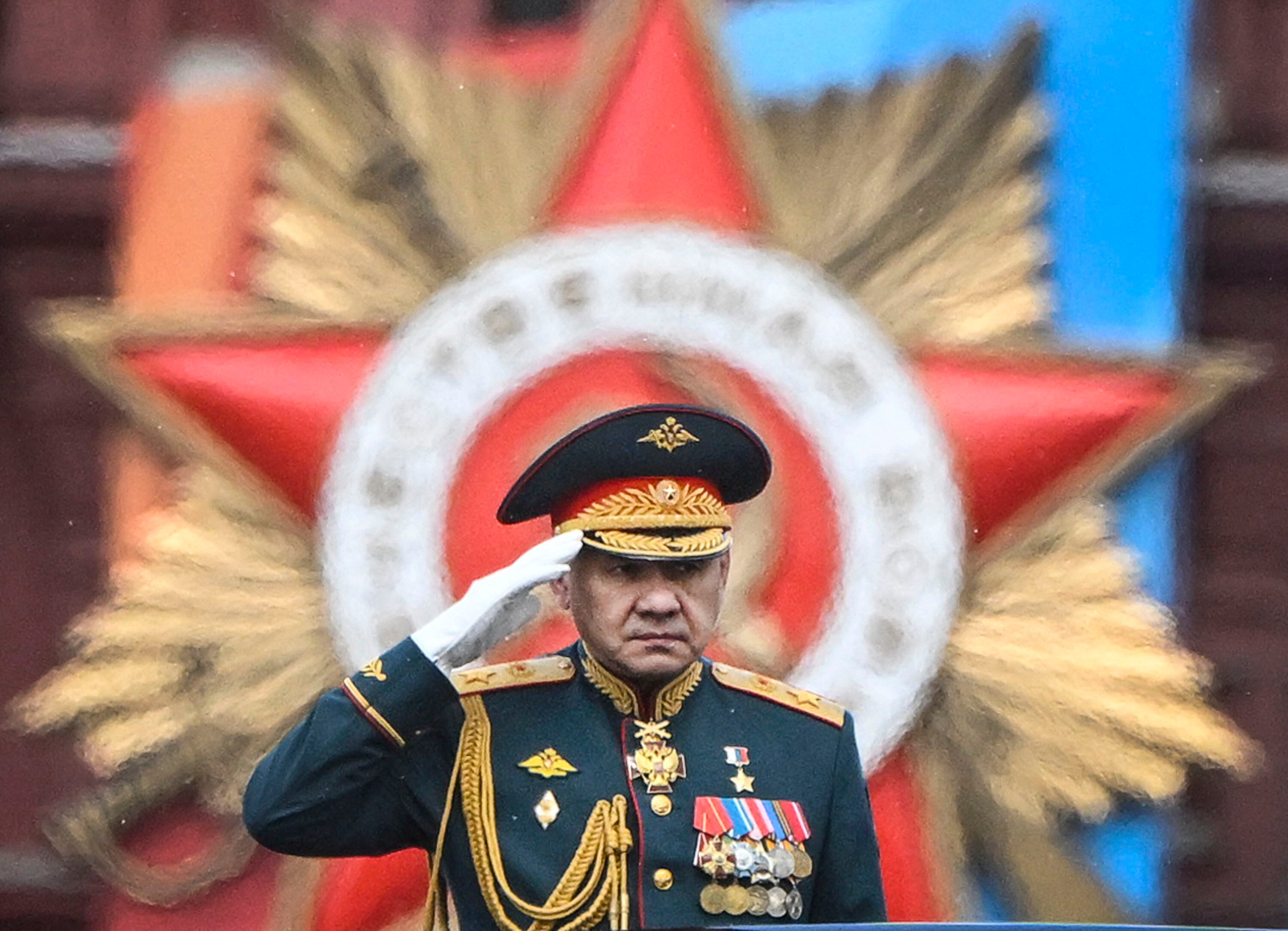 Russian Defense Minister Sergei Shoigu salutes soldiers as they lead him through Red Square during the Victory Day military parade in central Moscow on May 9, 2024. (Photo by Alexander NEMENOV/AFP).