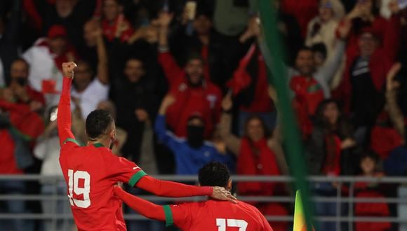 Morocco's forward Sofiane Boufal (R) celebrates after scoring the first goal during a friendly football match between Morocco and Brazil at the Ibn Batouta Stadium in Tangier on March 26, 2023. (Photo by Fadel Senna / AFP)
