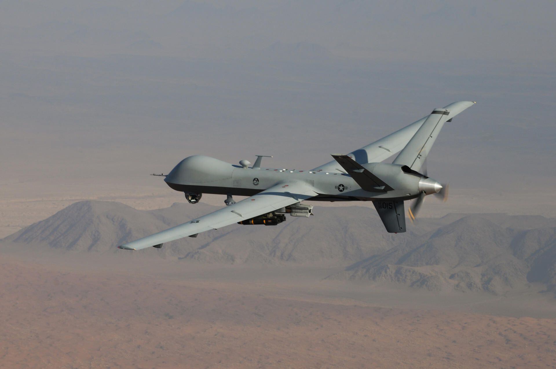 An MQ-9 Reaper drone, armed with GBU-12 Paveway II laser-guided munitions and AGM-114 Hellfire missiles, during a combat mission over southern Afghanistan.  (EFE/Leslie Pratt/US Air Force).