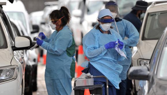 Las autoridades de Nueva Gales del Sur emitieron una norma mediante la cuál es obligatorio reportar el resultado positivo de una prueba de COVID-19 ante el pico de contagios en el estado. Quienes no cumplan con el mandato serán sancionados con una multa económica. (Foto: Muhammad Farooq / AFP)