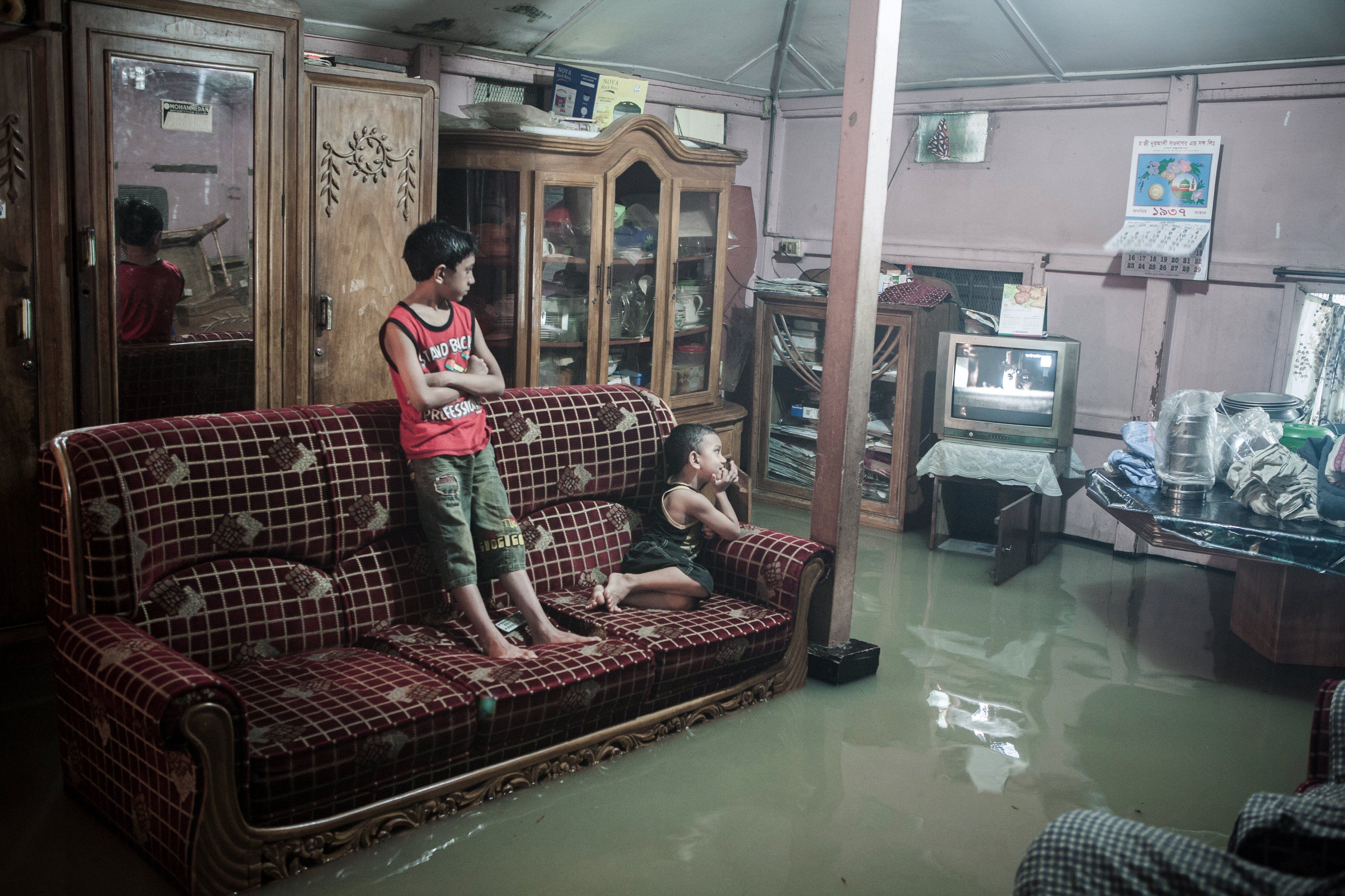 Salam's footage shows how people in Chittagong try to live as normally as possible when the waters rise.  / JASHIM SALAM
