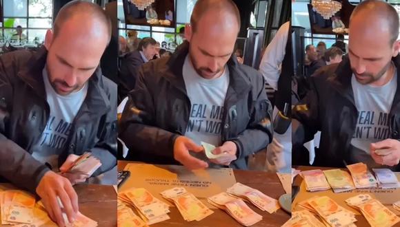 Hijo de Jair Bolsonaro es captado pagando una cuenta en Argentina con un fajo de billetes y se vuelve viral. (Captura de video).