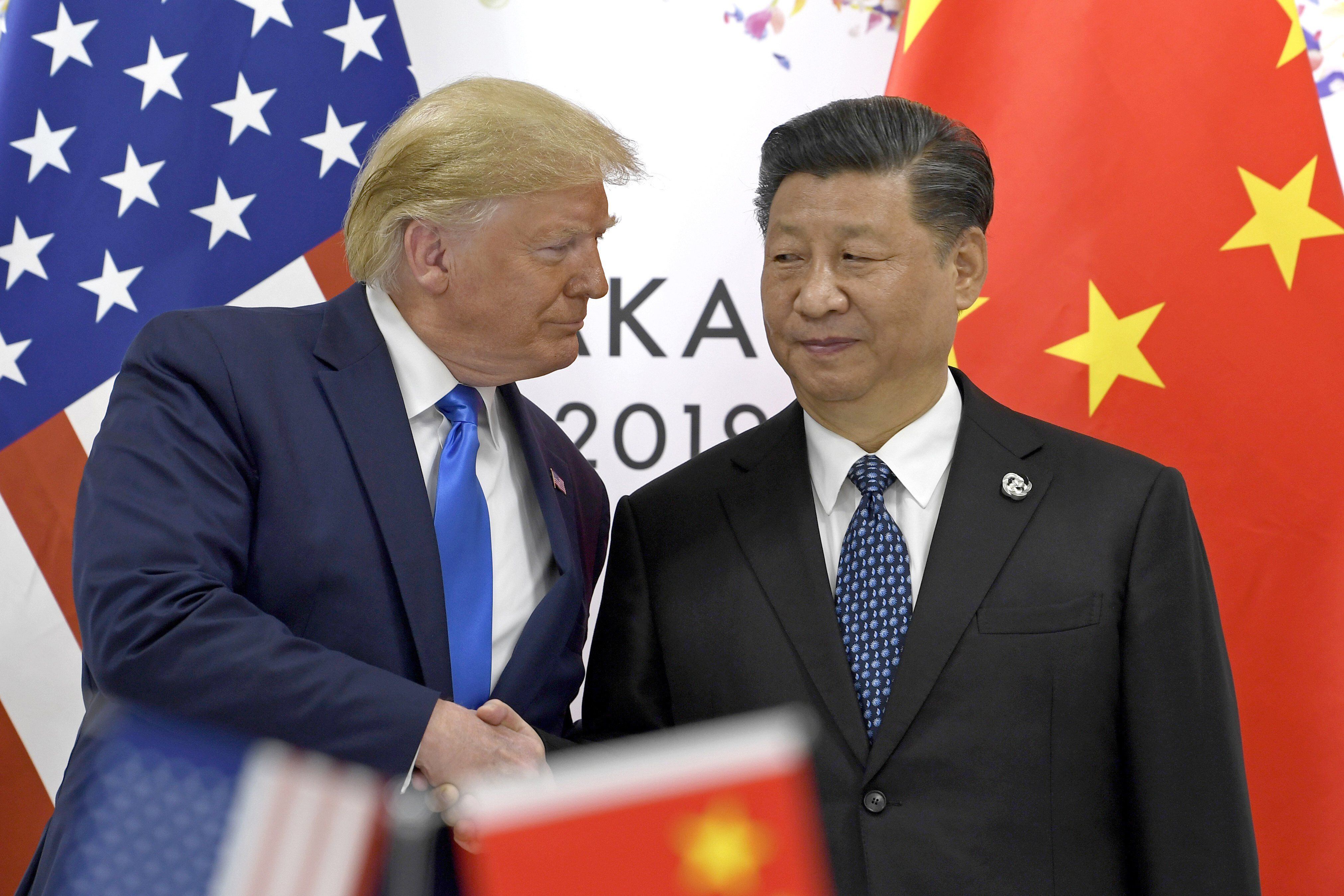 Image from 2019 in which the former US president, Donald Trump, and his Chinese counterpart, Xi Jinping, shake hands.  AP 