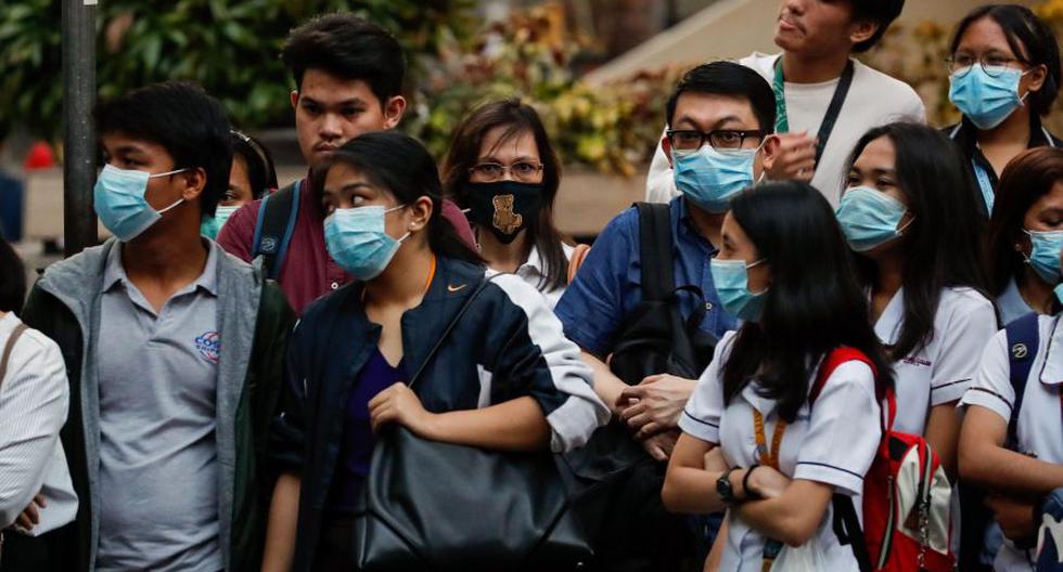 Ciudadanos filipinos usan máscaras para protegerse contra la propagación del Coronavirus. (Foto: EFE).