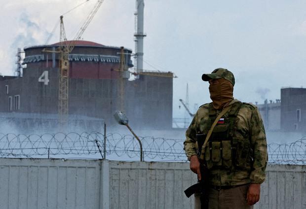 A Russian soldier stands guard near the Zaporizhia nuclear power plant in Ukraine on August 4, 2022.  (REUTERS/Alexander Ermochenko/File Photo).