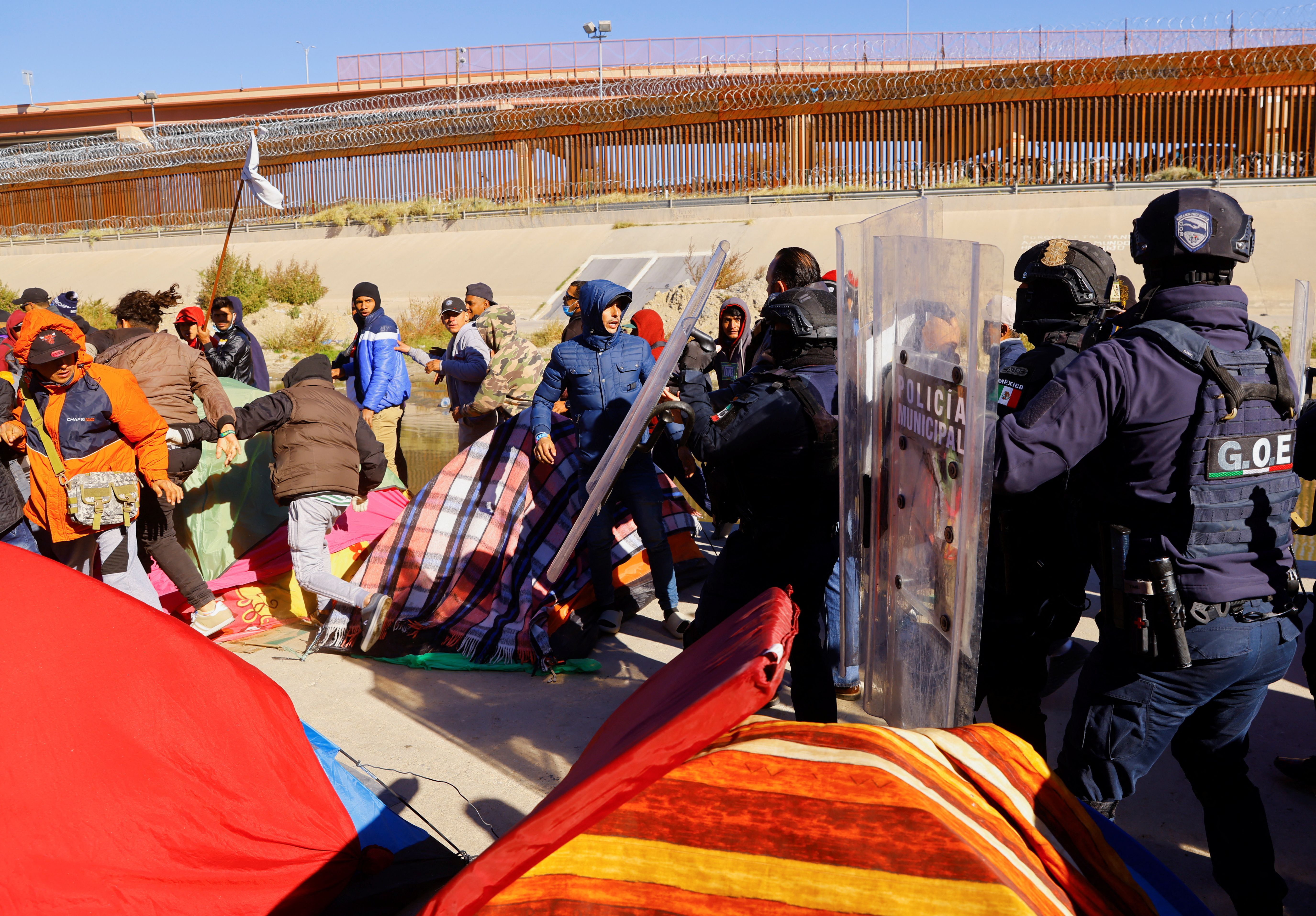 Police remove Venezuelan migrants from a camp on the banks of the Rio Grande, in Ciudad Juárez, Mexico.