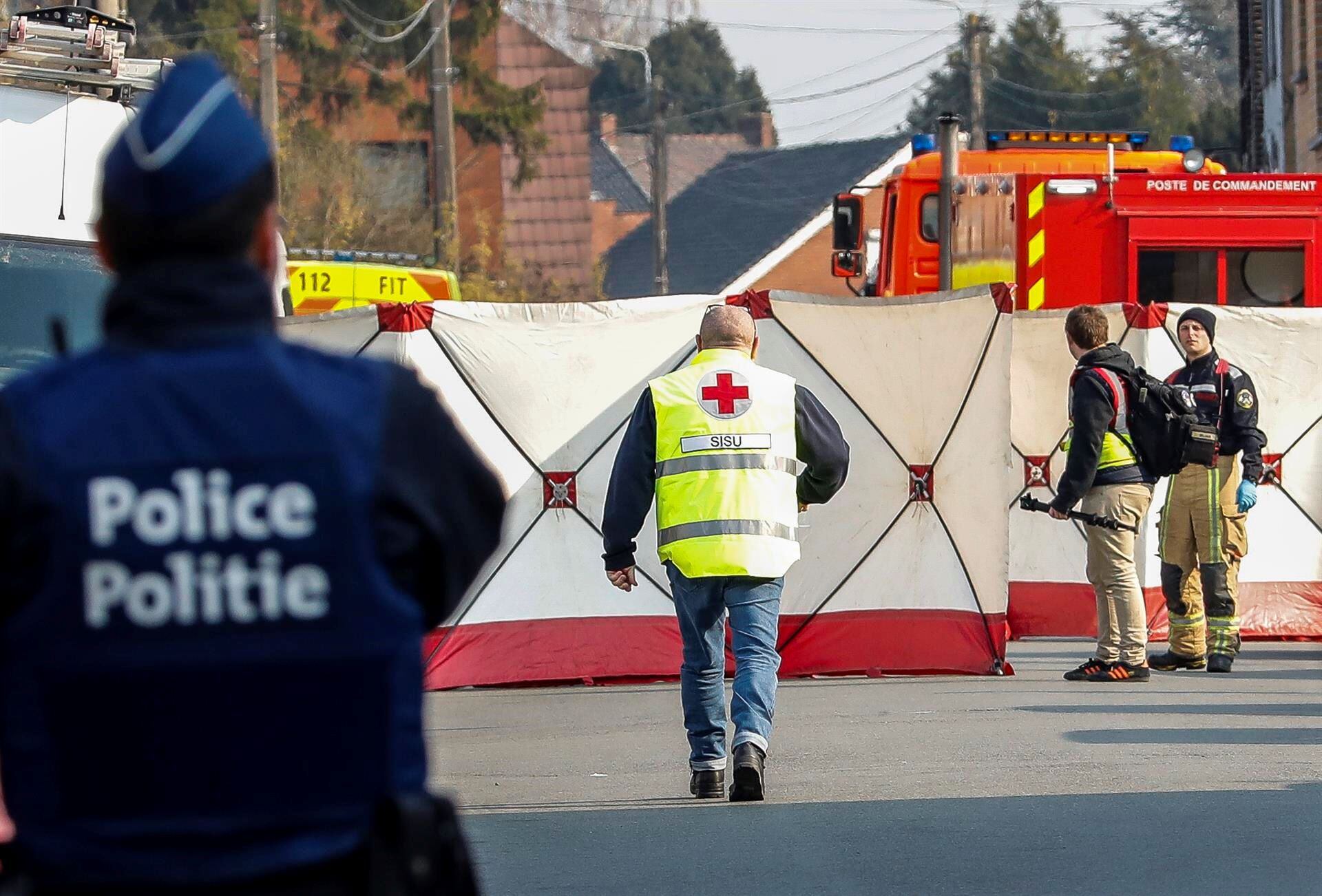 A police officer stands guard at the cordoned off scene in Strepy Bracquegnies, Belgium.  (EFE/EPA/JULIEN WARNAND).