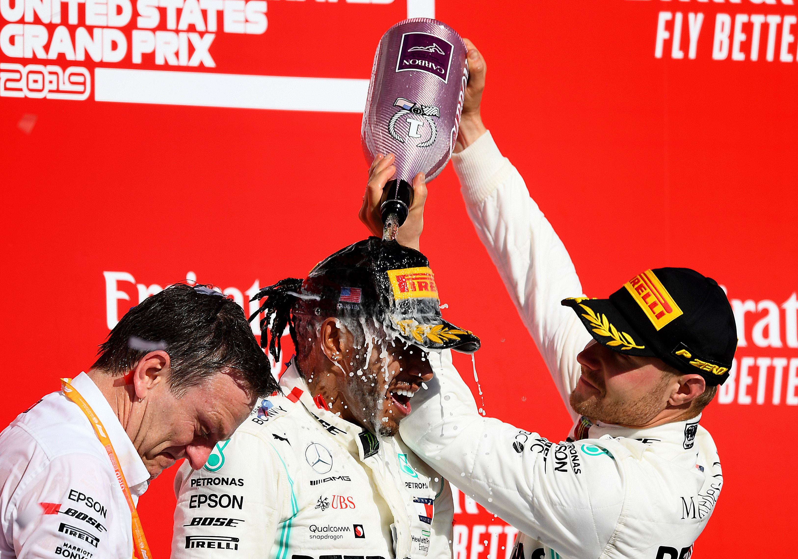 AUSTIN, TEXAS - NOVEMBER 03: Race winner Valtteri Bottas of Finland and Mercedes GP, 2019 Formula One World Drivers Champion Lewis Hamilton of Great Britain and Mercedes GP and James Allison, Technical Director at Mercedes GP celebrate on the podium during the F1 Grand Prix of USA at Circuit of The Americas on November 03, 2019 in Austin, Texas.   Clive Mason/Getty Images/AFP
== FOR NEWSPAPERS, INTERNET, TELCOS & TELEVISION USE ONLY ==
