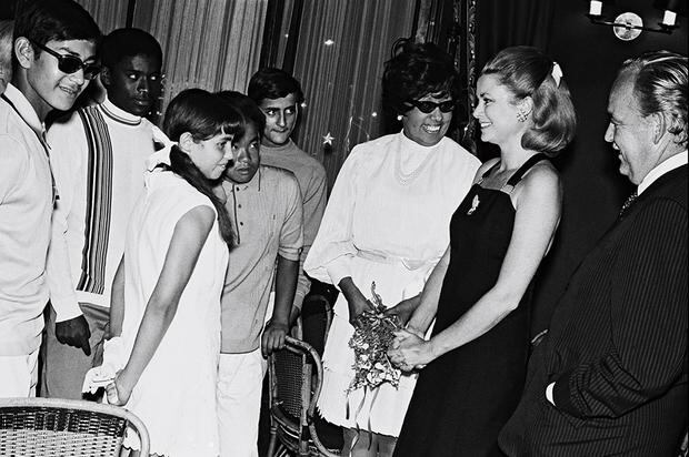 Grace Kelly and Prince Raniero host Josephine Baker and their children in Monaco in 1969. (Getty Images).