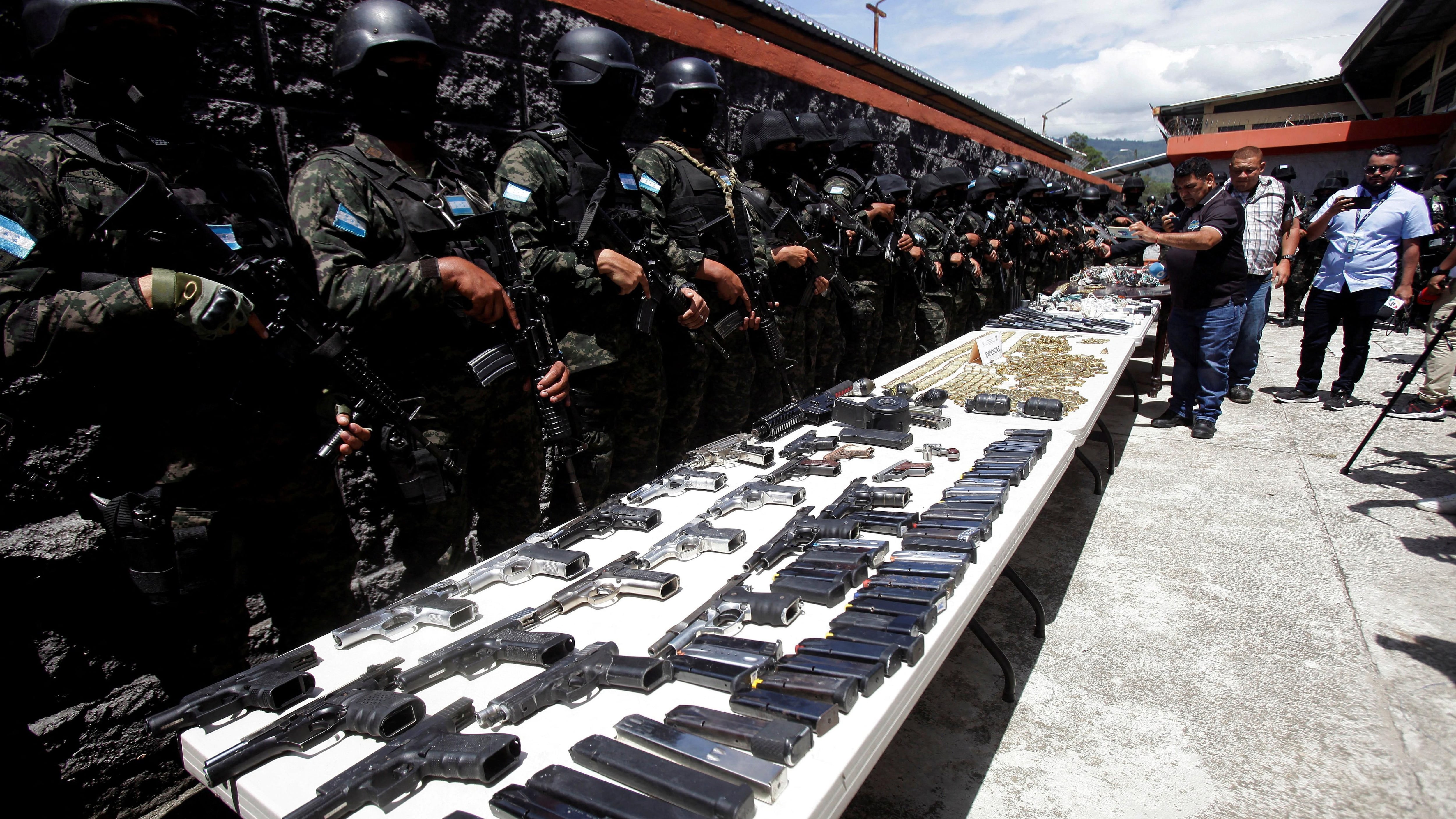 Honduran officials seized weapons, satellite phones, grenades, and drugs, among other things, from prisons.  (REUTERS).