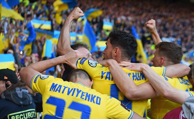 Ukraine's striker Roman Yaremchuk celebrates scoring the team's second goal during the FIFA World Cup 2022 play-off semi-final qualifier football match between Scotland and Ukraine at Hampden Park in Glasgow, Scotland on June 1, 2022.  (Photo by ANDY BUCHANAN                        / AFP)
