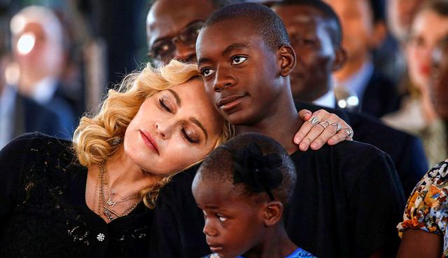 US singer Madonna embraces her adopted son, David Banda ahead of the opening of the Mercy James hospital in Blantyre, Malawi, July 11,2017. Reuters/Siphiwe Sibeko     TPX IMAGES OF THE DAY