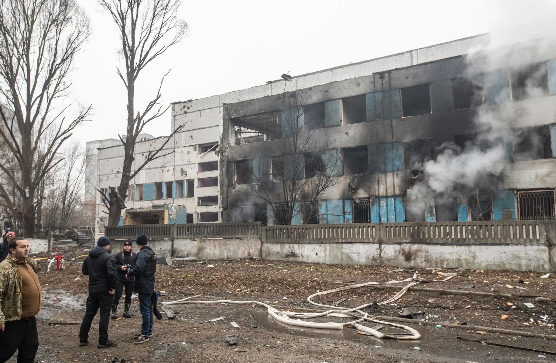A Ukrainian official near the site of a nighttime rocket attack on a maternity hospital in Dnipro, Dnipropetrovsk region, southeastern Ukraine, on December 29, 2023. (EFE/EPA/ARSEN DZODZAIEV).