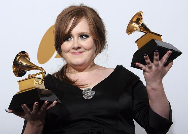 British singer Adele holds the Grammy Awards for Best New Artist and Best Pop Female Vocal Performance for "Chasing Pavements during the 51st annual Grammy Awards held at the Staples Center in Los Angeles on February 8, 2009.