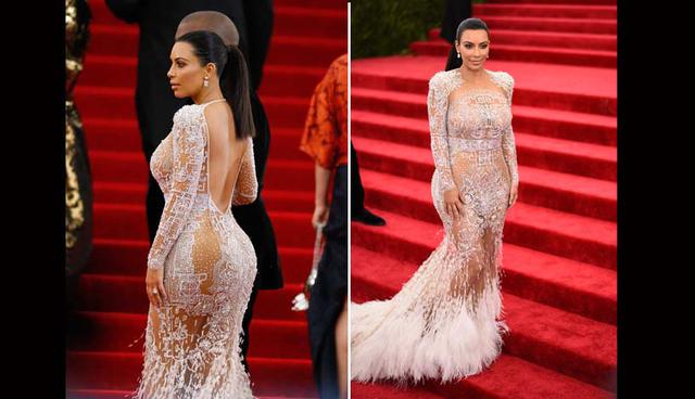 Kim Kardashian. La popular socialité optó para la MET Gala del 2015 por un vestido de encaje color perla de Roberto Cavalli, que marcaba sus curvas. (Foto: AFP)