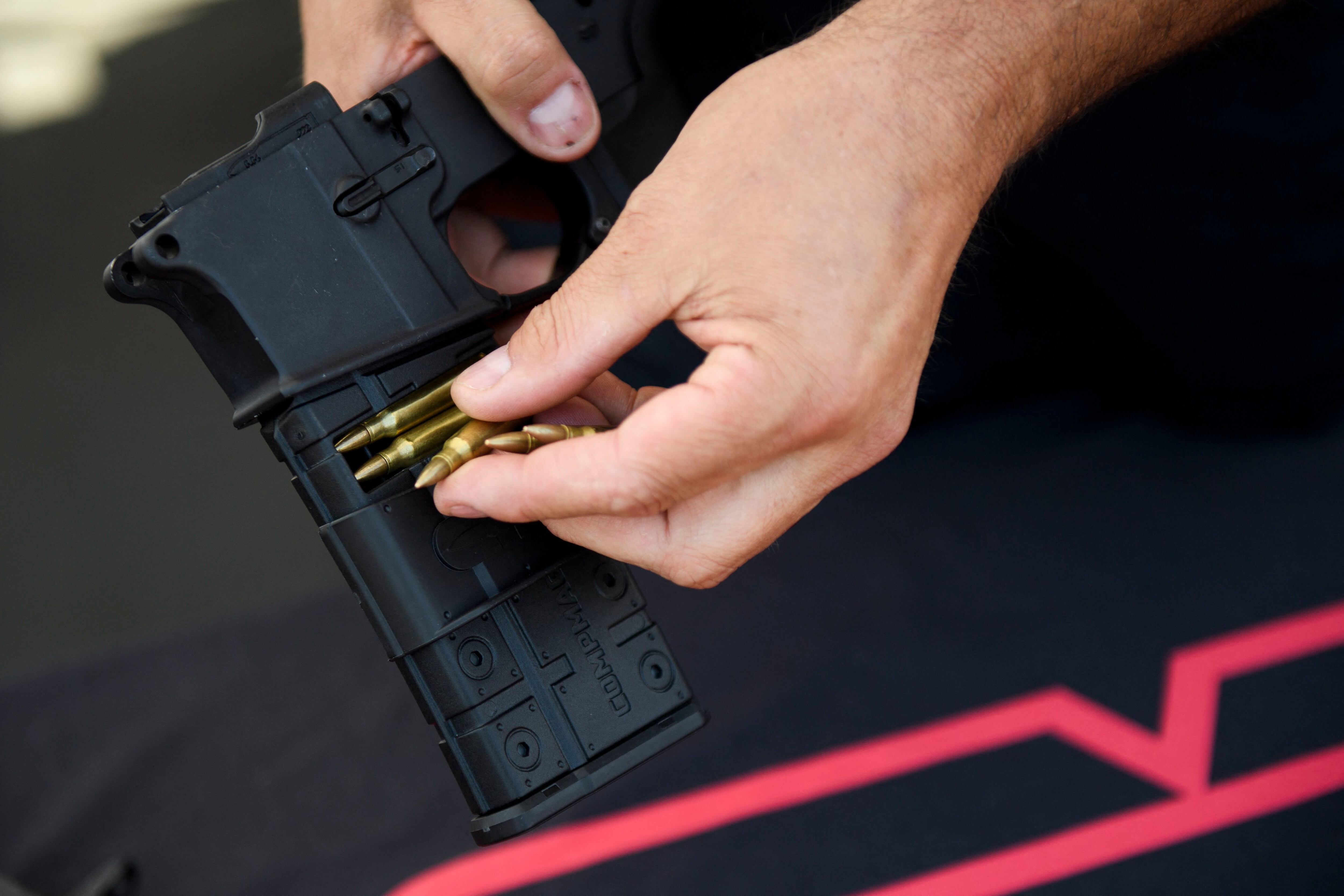 A CompMag fixed magazine conversion kit for an AR-15 rifle, installed to make the weapon compliant with restrictive states like California.  (Photo by Patrick T. FALLON / AFP).