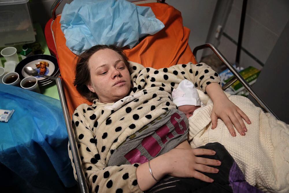 Mariana Vishegirskaya after giving birth to her daughter Veronika last Friday (AP Photo/Evgeniy Maloletka).