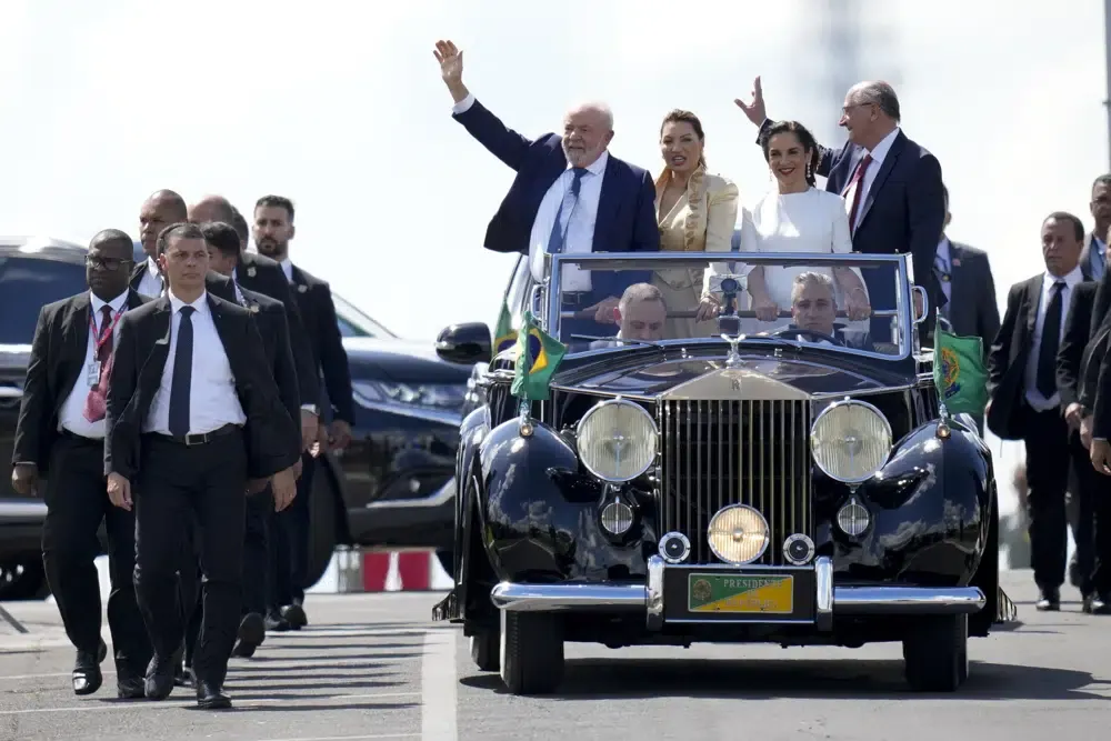President Luiz Inácio Lula da Silva, his wife Rosangela Silva, Vice President-elect Geraldo Alckmin and his wife María Lucía Ribeiro drive in a convertible car towards Congress, on Jan. 1, 2023. (AP Photo/André Penner).
